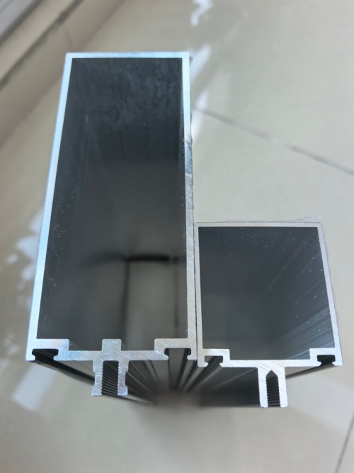 Cross-section drawing of a 70mm series aluminum thermal break window profile showing PA66 strip location, glazing bead channel, drainage slots and Euro-groove hardware slot dimensions Cross-section drawing of a 70mm series aluminum thermal break window profile showing PA66 strip location, glazing bead channel, drainage slots and Euro-groove hardware slot dimensions